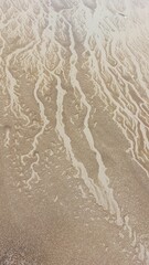 Close up of sand on the beach in winter. Abstract background.