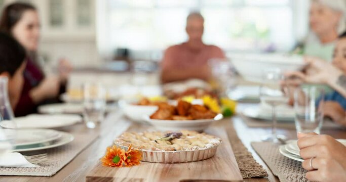 Home food, lunch pie and family eating meal, dessert or brunch buffet for Thanksgiving holiday. Love, dining room and bonding man, woman or people pass plates, hungry and enjoy quality time together