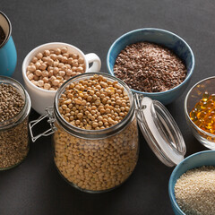 Source of vitamin E and nutrients in bowls on the table, copy space