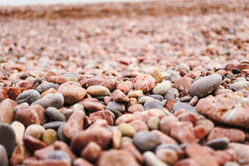 Sea coast with small stones, coast background