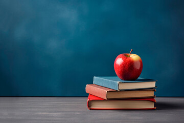 Three books and one apple on them, blue and grey background, back to school concept with copy space created with Generative AI technology