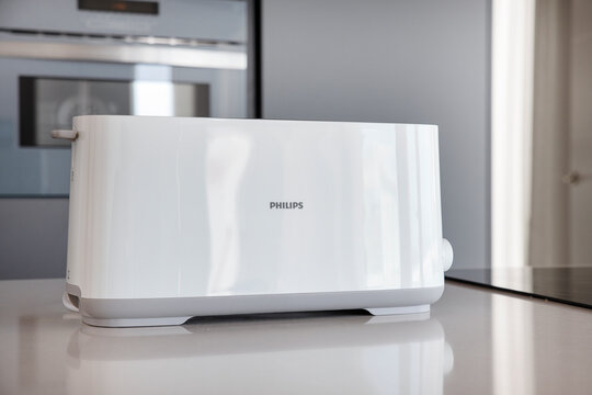 Tenerife, Canary Islands, Spain - April 18, 2023: pop-up bread toaster on kitchen counter produced by Philips, Dutch brand known for its consumer electronics, home appliances and household essentials