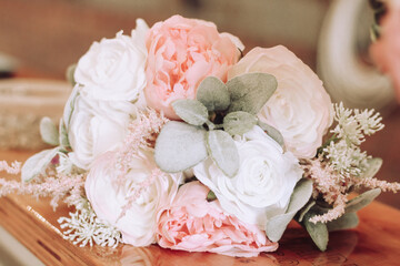 A romantic pink and white bouquet of roses for wedding inspiration or other special occasion where a peony floral display might be needed. 