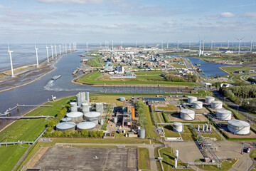 Aerial from windmills and industry at Eemshaven in the Netherlands - obrazy, fototapety, plakaty