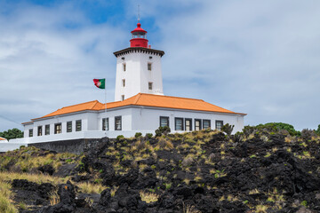 Fototapeta na wymiar Lighthouse on Pico island / Lighthouse on the coast of Pico island, Azores, Portugal.