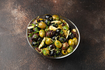 Marinated olives with fresh herbs, garlic, red wine vinegar and lemon zest