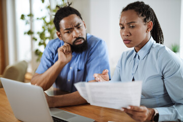 African American business couple working on a computer in the office