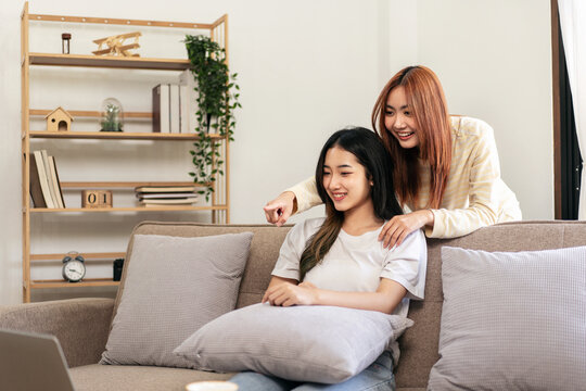 Young Woman Lesbian Couple Watching Movie Or Entertainment On La