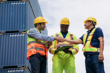 Foreman checking inventory or task details at Container cargo harbor. Logistics concept inside the shipping, import, and export industries.