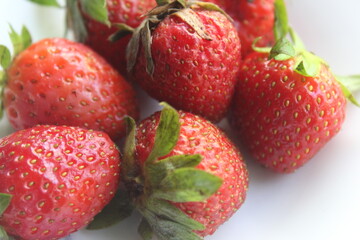 some fresh strawberries in a small plate