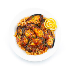 Italian Pasta Fusilly with Mussels mixed with Sauce fusion Style decoration lemon topview