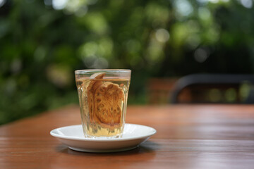 Bael juice glass cup closeup