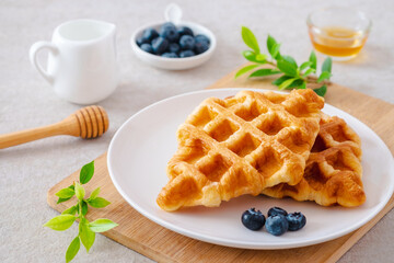 Croffle or croissant waffle with blueberries on plate