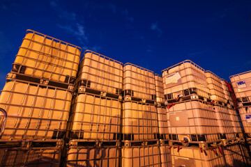 The stock of plastic barrels for the chemical industry. white plastic containers. Chemical industry. The machine brought chemical