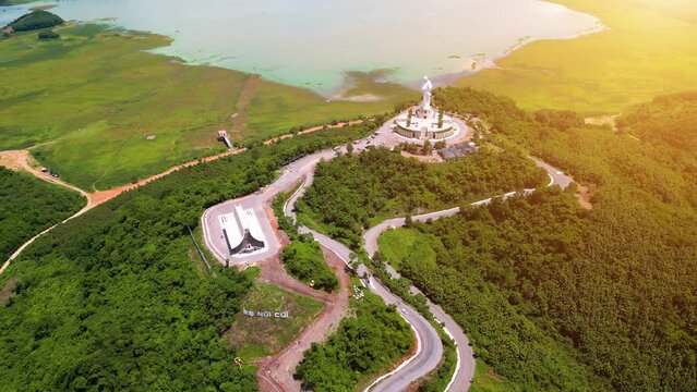 Aerial view of Our lady of Lourdes Virgin Mary catholic religious statue on a Nui Cui mountain in Dong Nai province, Vietnam.