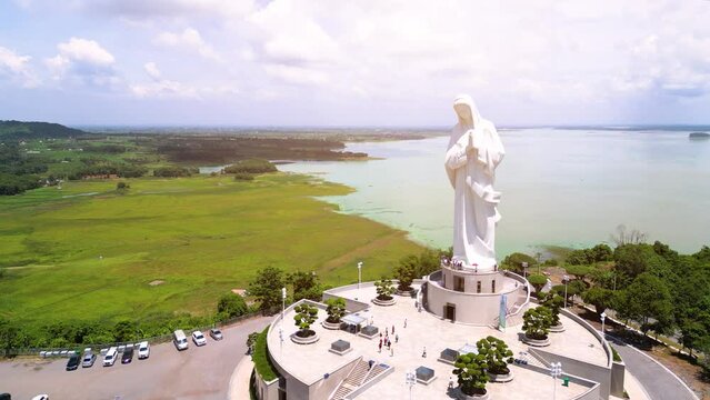 Aerial view of Our lady of Lourdes Virgin Mary catholic religious statue on a Nui Cui mountain in Dong Nai province, Vietnam.