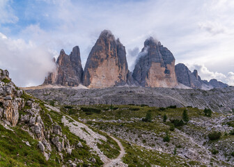 Amazing view of mountainous area with majestic peaks of Tre Lavaredo covered with clouds. three spectacular mountain peaks Dolomites, South Tyrol, Italy. Wildlife painting