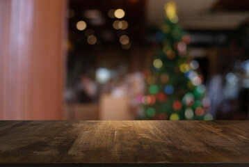 Empty wood table top and blur of night market background/selective focus .For montage product display.