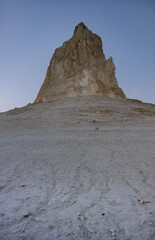 Fototapeta premium Chalk and limestone remains in the Kazakh steppe in the evening, vertical landforms after weathering