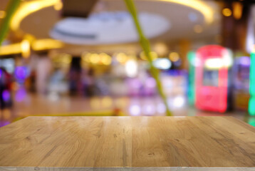 Empty wooden table in front of abstract blurred background of coffee shop . can be used for display or montage your products.Mock up for display of product