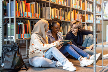 Group of diverse students in a library