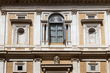 Close view on the facade of a traditional building in Rome, Italy. Architecture of Rome.