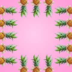 Fototapeta na wymiar Bonbon candy frame made of pineapple fruit with pink bows on pastel pink background. Original summer design. Minimal fruit concept. Creative advertisement idea. Fruit candy. Copy space, template.