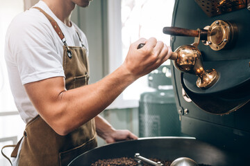 Small Business Owner's Caucasian Male Working in Coffee Beans Warehouse, Quality Coffee Production, Small Business Owner's Expertise in Coffee Roasting.