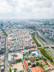 Obraz premium Aerial view of Ho Chi Minh City skyline and skyscrapers in center of heart business at Ho Chi Minh City downtown. Cityscape and many buildings, local houses