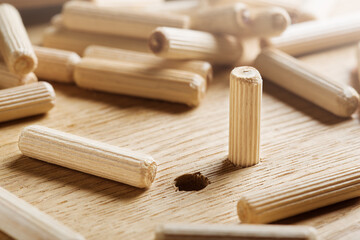 hole in wooden oak board for wooden dowel. carpentry industry.