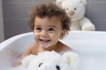 Funny little girl playing in a children's bathtub with a rubber duck, water and foam.