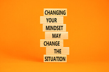 Changing mindset symbol. Concept words Changing your mindset may change the situation on wooden blocks on a beautiful orange table orange background. Business motivational Changing mindset concept.