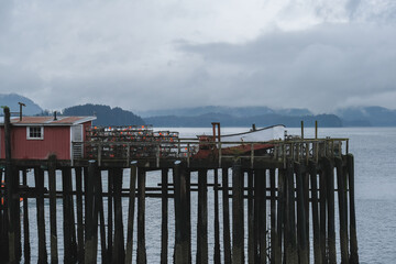 Old wooden Fishermen pier for fishing boats in Hoonah, Icy Strait Point in Alaska