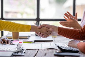 Selective Focus on hands.Photo of partners clapping hands after the business seminar. Professional...