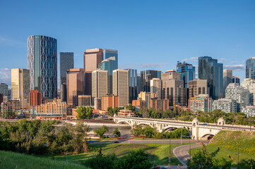 Calgary's skyline along the Bow River on a beautiful summer morning.