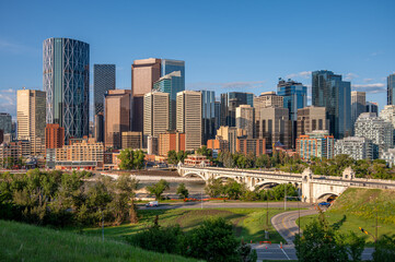Calgary's skyline along the Bow River on a beautiful summer morning.