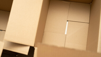 open cardboard boxes close-up, cutout for handle in cardboard box