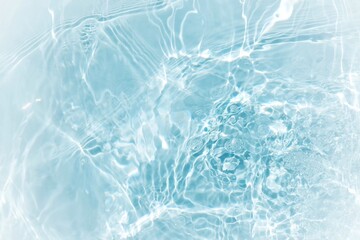 Blue water with ripples on the surface. Defocus blurred transparent blue colored clear calm water...