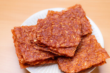 Sliced sheets of dried and crispy pork