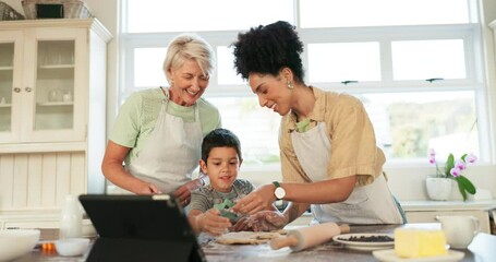 Happy, tablet and family with baking help from a child in the kitchen for breakfast or lunch together. Interracial, learning and women teaching a kid cooking with food and technology for a recipe