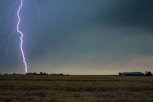 Nearby lightning strikes in a wheat field