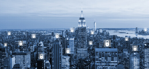 Cybersecurity lock and diverse network icons hologram. New York blurred cityscape. Concept of cybersecurity and data privacy.