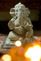 Handmade clay sculpture of Hindu God Ganesha being worshiped during Ganesh festival, India.
