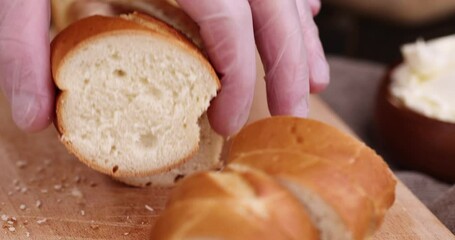 take soft fresh long french bread in the kitchen, cooking using wheat baguette - Powered by Adobe