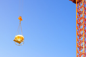 Tub on tower crane for concrete blue sky on background