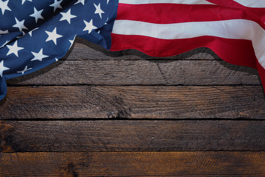 USA flag on wood background.