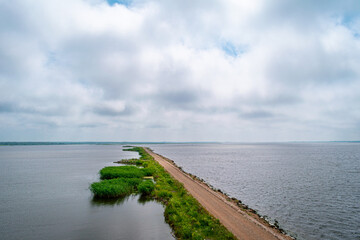 Horse Island Birdwatch Tower on the pier into the Liepaja lake in Liepaja, Latvia during sunny summer day