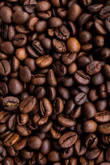 A close-up of roasted coffee beans can be used as a background for your coffee project