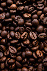 A close-up of roasted coffee beans can be used as a background for your coffee project