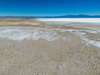 Aerial view of the huge salt flats Salinas Grandes de Jujuy in northern Argentina while traveling South America 